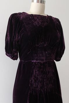 "Gorgeous purple velvet dress from the late 1930s. This dress features large voluminous sleeves, unique ruching details, and a flattering waistline. snaps on side for closure. likely homemade. . Label: none . Measurements: { small } Bust: 34\" Waist: 27\" Hips: open Length: 39\" Sleeve Length: 12.5\" . Condition: really great vintage condition with minor signs of wear. a little imperfectly sewn as it's likely homemade. sold as is. ☆Shop☆ http://www.trunkofdresses.com/" 40s Outfits, Vintage 1930s Dress, Purple Velvet Dress, 40s Dress, Dresses 40s, 1930s Dress, Green Velvet Dress, Voluminous Sleeves, Most Beautiful Dresses