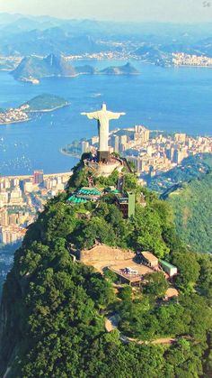 an aerial view of the statue of christ on top of a hill in rio, brazil