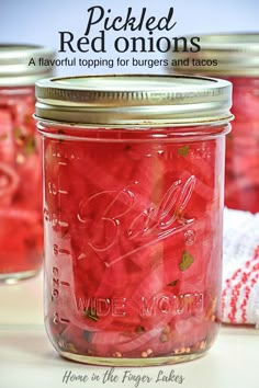 pickled red onions in a mason jar with text overlay reading pickled red onions a flavor topping for burgers and tacos