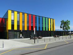 a multicolored building on the corner of a street