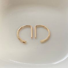 Tiny Half Hoop D Sleeper Huggie Earrings, Little Semi-circle Ear Hugging Earrings, D Ear Hugging Hoops, Everyday Minimalist Jewelry - Etsy Italy Everyday Small Hoop Ear Cuff, Dainty Hoop Ear Cuff For Everyday, Minimalist Small Hoop Ear Cuff, Dainty Small Hoop Ear Cuff For Everyday, Adjustable Minimalist Hoop Ear Cuff, Minimalist Semi-circle Hoop Earrings For Gift, Minimalist Semi-circle Hoop Earrings As Gift, Adjustable Minimalist Huggie Wrap Earrings, Minimalist Adjustable Huggie Wrap Earrings