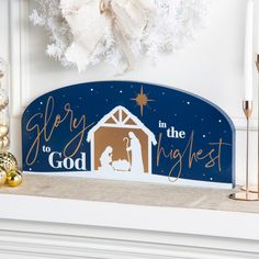 a christmas manger scene with the birth of jesus and mary in blue, gold and white