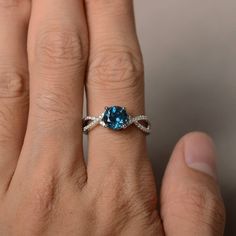 This is a gorgeous handmade creation. Its beauty is its simplicity & Elegance. The 7*7 mm round shape faceted real London Blue Topaz is crafted in solid sterling silver and with rhodium plated. All item is sent in a beautiful gift box If you have any idea of design your ring,pls contact me directly. You can realize more lovely stuff clicking the link https://www.etsy.com/shop/knightjewelry?refshopsection_shophome_leftnav Please leave the correct address and you phone number for delivering su 14k White Gold Topaz Birthstone Promise Ring, Sterling Silver Round Topaz Promise Ring, Sterling Silver Solitaire Topaz Promise Ring, Topaz Birthstone Ring For Promise With Round Cut, Round Cut Topaz Solitaire Promise Ring, Round Cut Solitaire Topaz Promise Ring, Promise Topaz Birthstone Ring, Elegant Topaz Birthstone Ring For Promise, Promise Blue Topaz Diamond Ring In Round Cut