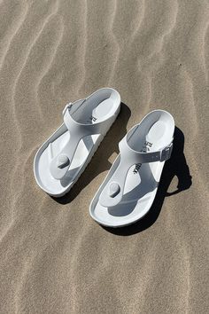 Birkenstock Beach White Sandal Update your shoe wardrobe with a stylish new pair of Birkenstock sandals. You'll love this T-bar style in white. Enjoy the ultimate in water resistant comfort footwear from Birkenstock. EVA foam upper in a foot bed sandal style with an open toe Slip on entry with adjustable buckle closure straps Buckle hardware detailing Soft lining with a contoured foam cushioned comfort foot bed Supportive shock absorbing midsole Flexible traction outsole Not sure about sizing? Review our birkenstock size guide! Birkenstock Beach, Gizeh Birkenstock, Birkenstock Eva, White Sandal, Sandal Style, Shoe Wardrobe, Bar Styling, Birkenstock Sandals, Foot Bed