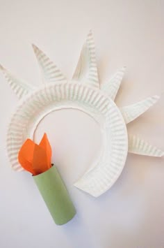 a paper plate with a flower sitting on top of it