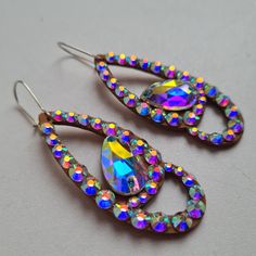 New collection of earrings! High quality of material, very shiny glass crystals, hold tight to your ears while dancing! Earrings catalog https://etsy.me/3IE3rZJ Necklace catalog https://etsy.me/3YM2jZO My profile on Linktree https://bit.ly/3JRVHEF Iridescent Jeweled Jewelry For Parties, Jeweled Dangle Teardrop Earrings For Party, Party Jeweled Dangle Teardrop Earrings, Teardrop Crystal Earrings With Rhinestones For Gift, Party Jeweled Teardrop Dangle Earrings, Teardrop Crystal Earrings With Rhinestones, Party Crystal Teardrop Earrings With Sparkling Stones, Teardrop Crystal Clip-on Earrings For Party, Handmade Teardrop Chandelier Earrings For Party