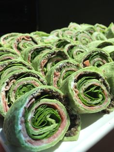 rolled up food item displayed on white plate