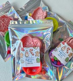 several packaged cookies and candy in plastic bags