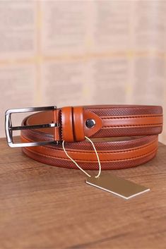 Discover the perfect fusion of elegance and practicality with our Cognac Gents Leather Belt, a timeless accessory designed to complement both your formal trousers and casual jeans. This belt, meticulously crafted from genuine leather, boasts a rich, textured finish in a warm cognac color, offering both style and versatility to the modern man's wardrobe. With a width of 1 3/8" | 3.5 cm, this belt ensures a perfect fit, sliding seamlessly through the loops of your favorite pants, securing them wit Mens Belt, Jeans Belt, Formal Trousers, Cognac Color, Jean Belts, Leather Texture, Suspender Belt, Timeless Accessories, Men's Wardrobe