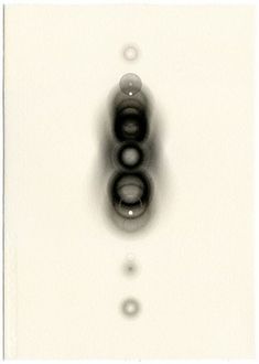 two black and white circles in the middle of a light switch