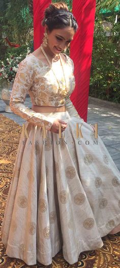 Buy Online from the link below. We ship worldwide (Free Shipping over US$100)  Click Anywhere to Tag Pooja Banerjee in Kalki beige brocade lehenga featuring the beautiful animal motifs f you are not the one with reds and pinks, go for the beige lehenga that is high on its fashion quotient.  The lehenga is featured in brocade.  It showcases deer motif prints that are so easy on the eyes and look absolutely stunning at the same time.  The lehenga comes with a ready stitched blouse in full sleeves Jacquard Dress Design, Celebrity Wear, Beige Lehenga, Design Lehenga, Brocade Lehenga, Indian Party Wear, Traditional Indian Outfits, Indian Gowns Dresses