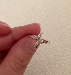 VINTAGE 10 KARAT DIAMOND CROSS RING ♥ ♡ ♥ ♡ ♥ ♡ ♥ ITEM DESCRIPTION:  * Band width: 1mm * Size  6.5 ‣ Cross Width: 12.8mm ‣ Diamond Weight: 0.03 carats * Condition: Great! Like new condition  ‣ All vintage items are professionally cleaned ♥ ♡ ♥ ♡ ♥ ♡ ♥ SHIPPING INFORMATION: ‣ Item comes with free tracked shipping within Canada ‣ If you do wish to have a faster shipping option please let us know!  ♥ ♡ ♥ ♡ ♥ ♡ ♥ Diamond Cross Rings For Gifts, Diamond Cross Ring For Gift, Cross-shaped Diamond Ring For Gift, Vintage Cross Ring As Gift, Vintage Cross Ring For Gift, Cross Ring With Diamond Accents For Promise, Gold Diamond Cross Ring, Diamond Accented Cross Promise Ring, Cross-shaped Promise Ring With Diamond Accents