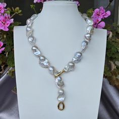 This strand is absolutely gorgeous! It represents the finest of the finest of Freshwater Baroque pearls. it has a 14Kt. Italian Gold Clasp weighing 7 grams. The necklace can be locked in two different ways:  1. With the little tail; and 2. As a whole necklace 3.  Adjustable length, you may lock the necklace on any pearl you wish These pearls anr rare, they  measure 16-24mm and have a pinkish overtone.  The length of the necklace is 54cm. Pearl Quality is AAAA Grade COLORS MAY VARY DUE TO LIGHT. Baroque Pearl Necklace, Wedding Jewellery Necklace, Beautiful Gift Boxes, Baroque Pearls, 14kt Gold, Wedding Necklace, Freshwater Pearls, Wedding Jewelry, Pearl Necklace