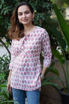 If you are looking for something light but professional, this shirt-style Kurti would be perfect for you. Made from 100% cotton, this Kurti lets you breathe, feels light and comfortable. And when it comes to the looks, the hand block print on pink is just magic to the eyes. The kurti comes with front buttons and round neck, pair this with our white cotton pants for perfect look or your denim Shirt Style Kurti, Short Kurti Designs, White Cotton Pants, Style Kurti, Just Magic, Designer Outfits, Indian Designer Outfits