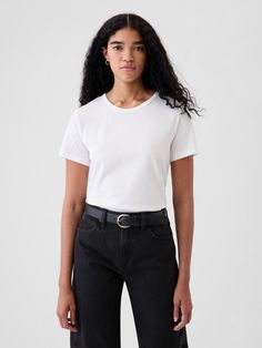 Made with 100% organically grown cotton.  Organic cotton is better for people and the environment because it’s grown without the use of harmful synthetic pesticides and fertilizers.  Short sleeves.  Crewneck.  Straight silhouette with a relaxed fit.  Hits at the hip.  Chloe is 5'8. 5/174cm with a 32"/81cm chest, 25"/64 cm waist and a 35"/89cm hip wearing a regular Gap Gap Tshirt, White Pants Outfit, White Crew Neck, Vintage Crewneck, Closet Essentials, Clothing Design, Jcrew Women, Pesticides, White Pants