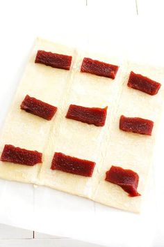 several slices of bacon are arranged on top of each other to make an appetizer