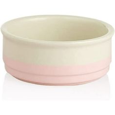 a pink and white bowl on a white surface