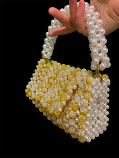 Handbag - Beaded white and yellow bag 100% handmade Material: acrylic beads Size: > width - 19 cm > height - 10 cm (20 cm with handle) > lateral width - 6 cm  The bag has removable handles, one on top and a chain over the shoulder Yellow Beaded Rectangular Bag, Yellow Beaded Bag For Gift, Yellow Beaded Party Bag, Elegant Handmade Yellow Shoulder Bag, Elegant Yellow Handmade Shoulder Bag, Elegant Yellow Beaded Bag, Yellow Beaded Bag For Everyday Use, Pearl Handbag, Bead Bag