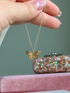 Embrace the beauty of transformation with our 14k Solid Gold Beautifully Detailed Butterfly Necklace. This elegant necklace features a meticulously crafted butterfly charm, symbolizing grace and renewal, delicately suspended from a 14k solid gold cable chain. P R O D U C T ∙ M E A S U R E M E N T S * 100% 14k Solid Gold * Necklace Length: adjustable from 16 to 17 inches * Necklace Width: 1mm * Chain Weight: 2.10 grams  Delivery:  * Ready to ship in 1 business day. * Delivers in 1 to 5 days depending on location and delivery option. * Returns are accepted within 7 days from the delivery date, at the customers cost. Gift Option: * We cherish the joy of gifting, as do you and your loved ones. Feel free to inform us if            you desire an additional personalized note with your order to ma Butterfly Necklace As A Gift, Round Butterfly Necklace For Gift, Round Butterfly Necklace Gift, Fine Jewelry Butterfly Charm As Gift, Gold Jewelry With Butterfly Charm For Gift, 14k Gold Pendant Necklace With Butterfly Charm, Fine Jewelry Butterfly Pendant Necklace As Gift, Fine Jewelry Butterfly Pendant Necklace, Butterfly Shaped Necklace With Adjustable Chain For Gift