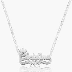 Our popular Double Plated Princess Crown Name Necklace boasts a chic and elegant design, handcrafted to perfection. The model showcases the necklace with an 18-inch Cuban chain (see video for reference). You can personalize this item with Letters, Numbers, and Roman Numerals and choose from chain lengths of 14", 16", 18", and 20". Each chain features a lobster clasp closure for secure wear.Chain width:Cuban Chain - 3.7 mmFigaro Chain - 3 mmRope Chain - 2.3 mm XO Chain - 5 mm Silver Necklace With Adjustable Chain In 14k Gold, Silver 14k Gold Charm Necklace With Adjustable Chain, Sterling Silver Pendant Name Necklace With Adjustable Chain, Sterling Silver Name Necklace With Adjustable Chain, Sterling Silver Nameplate Necklace With Adjustable Chain, Silver Clavicle Chain Nameplate Necklace, Silver Clavicle Chain Necklace With Nameplate, Classic Chain Necklace With Polished Finish For Gift, Classic Polished Chain Necklace As Gift