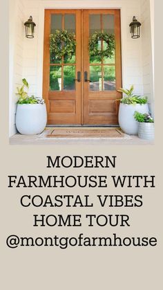 two large planters with wreaths on the front door