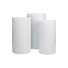 three white vases sitting next to each other