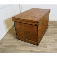 an old wooden box sitting on the floor