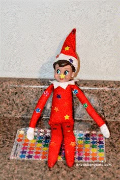 an elf doll sitting on top of a counter