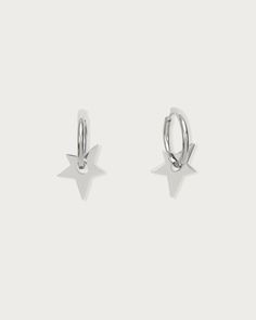 small silver star hoop earrings on a white background