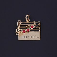 Vintage Rock N Roll Charm: Step into the mid-century with this vintage 1960s charm, featuring a music bar crafted from 14k gold adorned with heart-shaped notes in red and black enamel.  The piece measures 0.8 inches from the top of the jump ring to bottom by 0.7 inches wide and weighs 1.87 grams. It is in great condition. Upon purchase, your charm will arrive elegantly packaged, ready for gifting or as a special treat for yourself.  We carefully wrap each piece to ensure a delightful unboxing experience. We also offer free and flexible layaway plans, so take advantage of this option to make owning your dream piece even more achievable. + Trademark Antiques Shop Homepage https://www.etsy.com/shop/TrademarkAntiques + Our Store Policies https://www.etsy.com/shop/TrademarkAntiques/policy?ref=s Music Bar, Bespoke Rings, Unboxing Experience, Vintage Rock, Antique Shops, Rock N, Black Enamel, Vintage 1960s, Red And Black