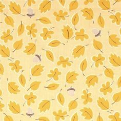 a yellow fabric with leaves on it