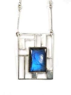 '- large rectangular labradorite cabochon with dark blue flash- handmade sterling silver bezel setting- silver geometric square wire and sheet, grid pattern, handmade square wire chain, handmade square hook clasp- polished sterling silver finish- hand crafted October 2016 Square Wire Jewelry, Modern Silver Necklace With Rectangular Stone, Handmade Modern Jewelry With Rectangular Stone, Modernist Handmade Rectangular Jewelry, Contemporary Sterling Silver Rectangular Jewelry, Contemporary Rectangular Sterling Silver Jewelry, Modern Handmade Jewelry, Jewelry Metalsmithing, Square Stone Pendant