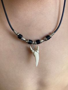 Necklace Length:  Approx. 18 inches Shark Tooth Length: Approx. 1-1/8 inch Each piece has a distinct character of its own, for no two are exactly alike in color, shape, and size. Hand-crafted, sanded and polished by Native artisans Adjustable Black Themed Necklace, Themed Black Beaded Jewelry, Hawaiian Design, Hawaiian Sunset, Moda Hippie, Mako Shark, Hawaiian Designs, Shark Tooth Necklace, Surfer Necklace