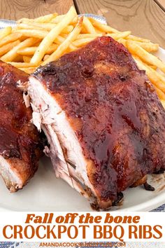 a plate with ribs, french fries and bbq sauce on it that says fall off the bone crockpot bbq ribs