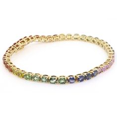 Natural Rainbow Oval Sapphire Tennis Bracelet - Made with Solid Gold and Top Quality Multi Color Sapphires ◆ Stone Details ◆ Stone: Natural Rainbow Sapphires Stone Shape: Oval Stone Size: 2.6 x 2.6mm Stone Weight: 7.5 to 8.5 cts (approx) ◆ Metal Details ◆ Metal: 10K, 14K, 18K Gold Colors: Yellow Gold, White Gold, Rose Gold Length: 6 - 8.5 inch ◆ Shipping Details ◆ Via FedEx Express Made to Order & Shipped within 10 Days Delivery: Within 7 Days Tracking ID provided ◆ Personalization ◆ Want to cha Yellow Gold Oval Bracelet With Multi-stone, Oval Multi-stone Tennis Bracelet In Fine Jewelry Style, Classic Oval Multi-stone Bracelet, Yellow Gold Oval Multi-stone Bracelet, Elegant Multi-stone Oval Tennis Bracelet, Elegant Oval Multi-stone Tennis Bracelet, Yellow Gold Multi-stone Oval Bracelet, Yellow Gold Multi-stone Oval Bracelets, Luxury Oval Multi-stone Tennis Bracelet