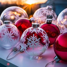 several red and white christmas ornaments on a table