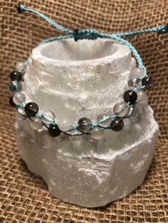 Quartz, rose quartz and Smokey quartz on a mint blue waxed polyester string.  Macrame knotted design Adjustable square knot slide closure.  Waterproof and more durable White Beads Bracelet, Square Knot, Macrame Knot, Mint Blue, Pink Beads, Quartz Rose, Smokey Quartz, White Beads, Quartz Stone