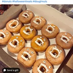 a box filled with lots of donuts covered in frosting and googly eyes