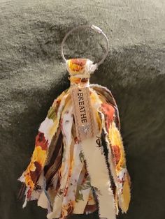 a piece of cloth with a tag hanging from it