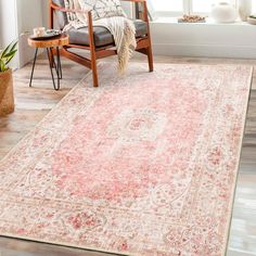 an area rug with a chair and window in the background