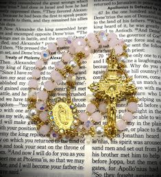 WELCOME TO OUR SHOP  This is a handmade Gorgeous rosary made from gorgeous pink and white petals. Finished with gold medal & crucifix! Made with the highest quality materials and glass beads. Thoughtfully designed and carefully made with the finest, high quality materials.  We can make any rosary you wish, just send us a photo and we can complete the job for you! Custom orders with personalized names, adding pictures and bulk orders are AVAILABLE :) We have variety of beads color selections and multiple designs that you can choose from for any occasion (Baptism, Birthday,  Communion, Wedding or just a gift for a friend). We take pride with the work and quality we offer, you satisfaction is our top priority. Add our shop to your favorites so you can be notified with our new product! We are Handmade Pink Rosary For First Communion, Handmade Pink Rosary For Baptism, Wedding Communion, Communion Wedding, Handmade Rosary, Custom Rosary, Catholic Gifts, Baptism Gifts, Gold Medal