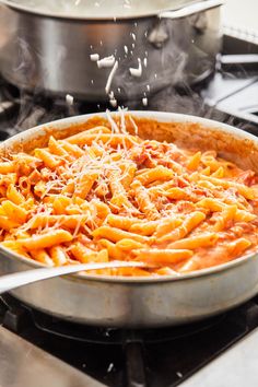 pasta being cooked in a skillet on the stove