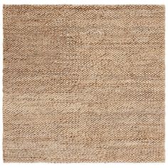 an area rug made out of jute and woven with a white border on the bottom