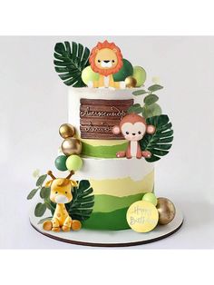 a three tiered cake decorated with jungle animals