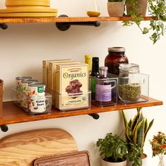 the shelves are filled with spices and herbs