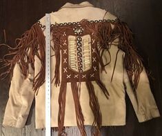 Mens JR Leather Native American western Jacket in a size Large. This leather jacket is just wicked. Words can’t explain the quality and detailed on it. Jacket has slight color stains and some fringes in the back are shorter than the rest. I’m not sure if that’s factory, but nevertheless it’s there. See pictures. Also the leather jacket is very heavy, mainly because it’s such great leather quality. Any questions feel free to message me. Condition is Pre-owned. Shipped with USPS 2 day handling Fitted Biker Outerwear For Festival, Fitted Biker Style Outerwear For Festivals, Western Style Fitted Leather Jacket For Winter, Biker Style Long Sleeve Outerwear For Festivals, Fitted Leather Jacket For Winter Festival, Fitted Western Outerwear For Rodeo, Vintage Leather Jacket For Fall Festival, Winter Festival Fitted Leather Jacket, Winter Leather Jacket For Rodeo