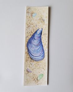 a painting of a blue sea shell on a white surface