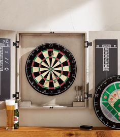 two darts are on the wall next to darts