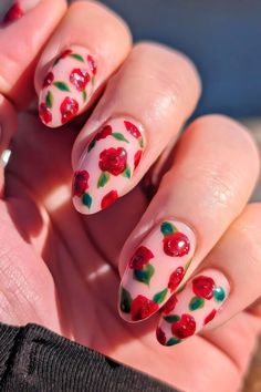 Pink background with intricately designed red roses on nails Pink Tulip Nails, Love Bug Nails, Raspberry Nail Art, Paisley Nails Design, Red Roses Nails, Rose Flower Nails, Roses On Nails, Pink Rose Nails, Red Floral Nails