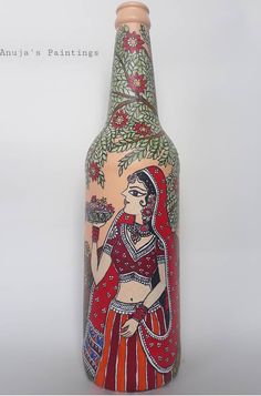 a painted bottle with a woman holding a flower